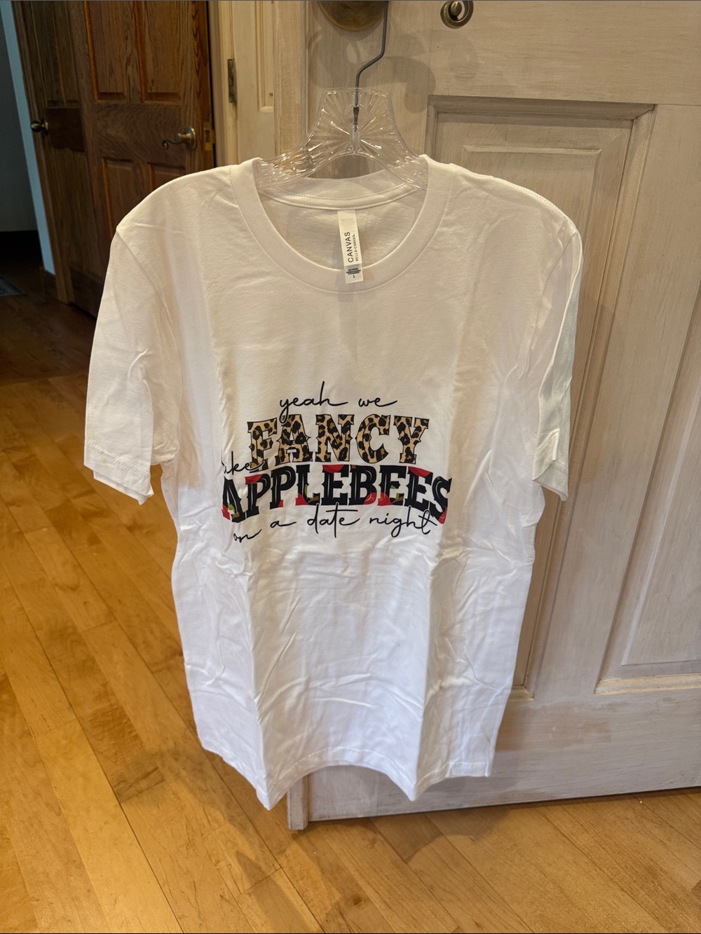 Bella Canvas White Graphic Tee with Leopard Applebees Print
